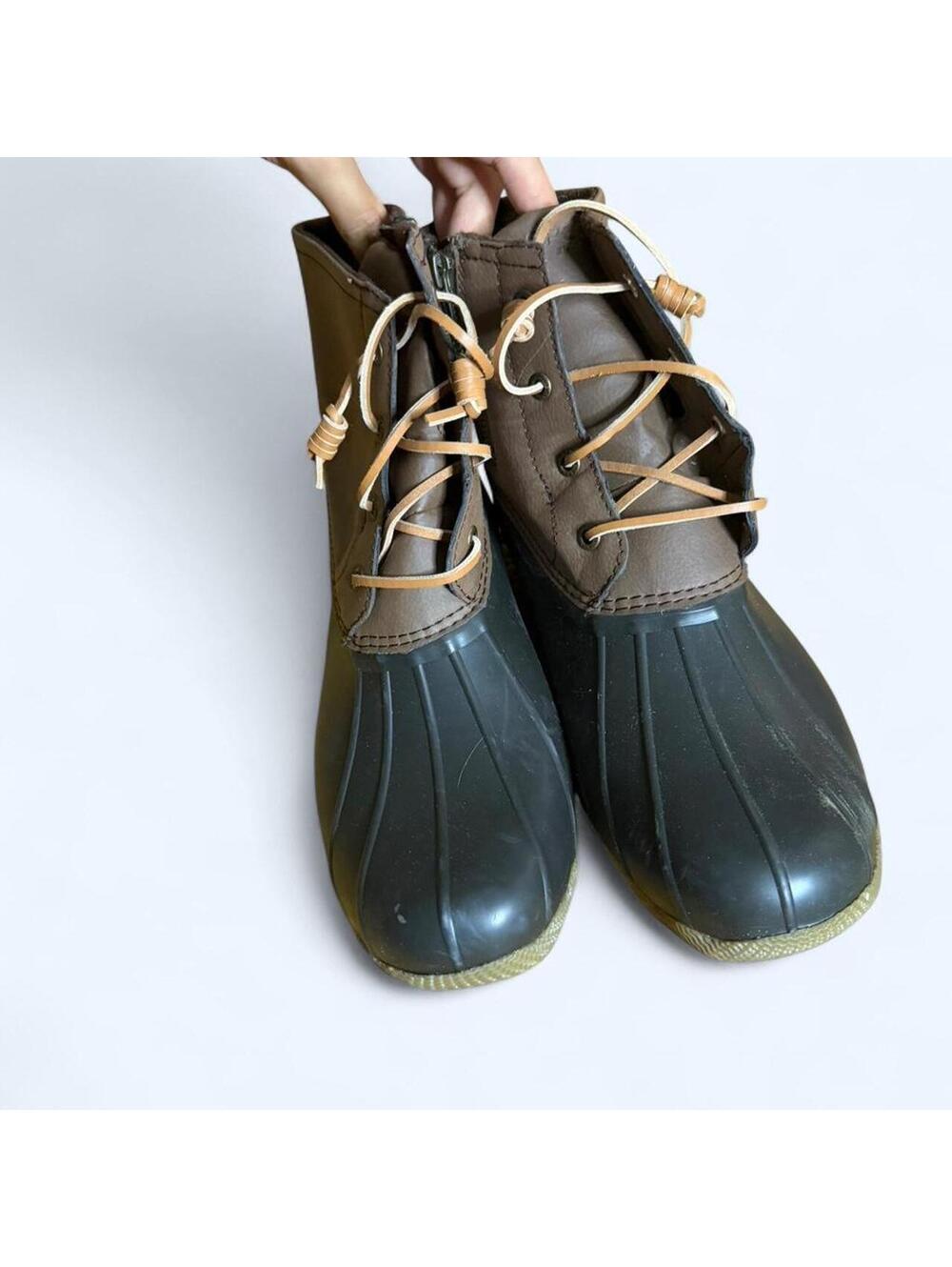 Brown and black Sperry duck boots
